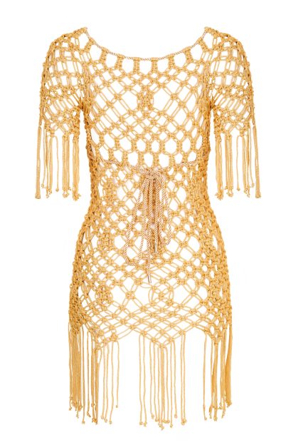 A handmade macramé dress in a rich mustard yellow color. The dress features intricate knot patterns with a loose, net-like design, short sleeves, and fringe details at the hem and sleeves. The back is tied with a delicate string for an adjustable fit, offering a bohemian and chic aesthetic.