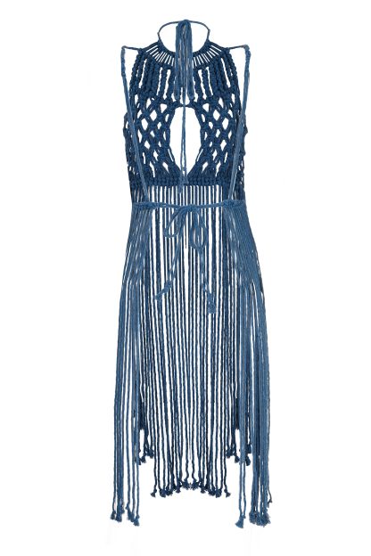 Petroleum blue macramé dress with an intricate knotted pattern on the bodice, featuring a keyhole cutout in the front. The dress has long, free-flowing strands that create a fringed effect, extending from the waist down to the hem, and ties around the neck for a halter-style fit.