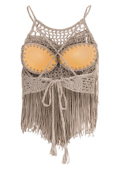 Beige macramé bustier with intricate crochet detailing at the top and long, flowing fringe strands cascading from the chest, creating a bohemian and elegant look.