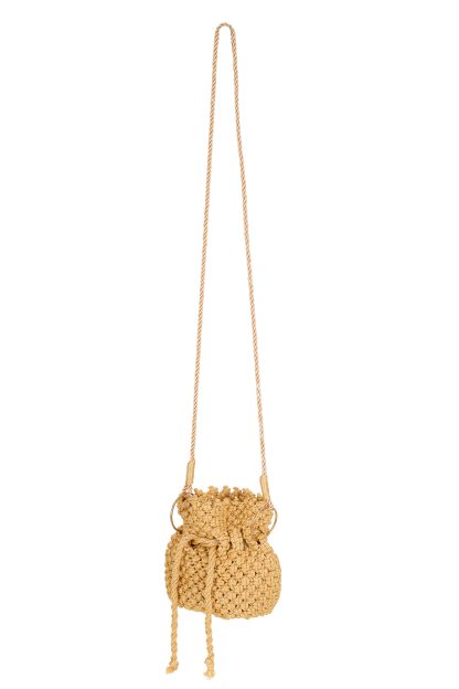 A handmade gold-colored macramé handbag with a drawstring closure, featuring a detailed woven texture and long twisted handles attached with golden rings.